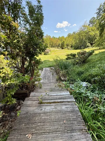 a view of a yard with an trees