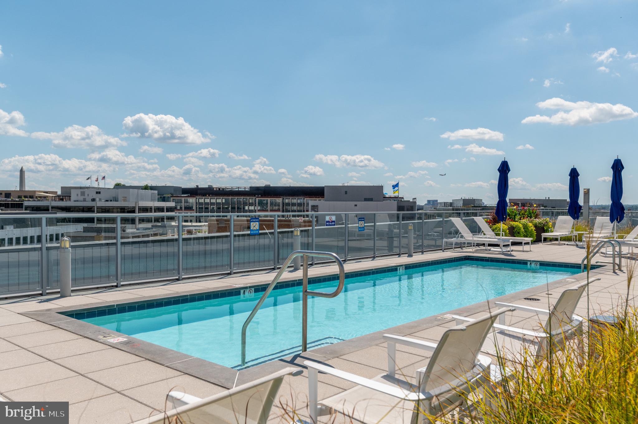 1177 22nd Street Northwest, Unit 2K Washington, DC 20037 - Photo 16 of 21 a view of a swimming pool with outdoor seating