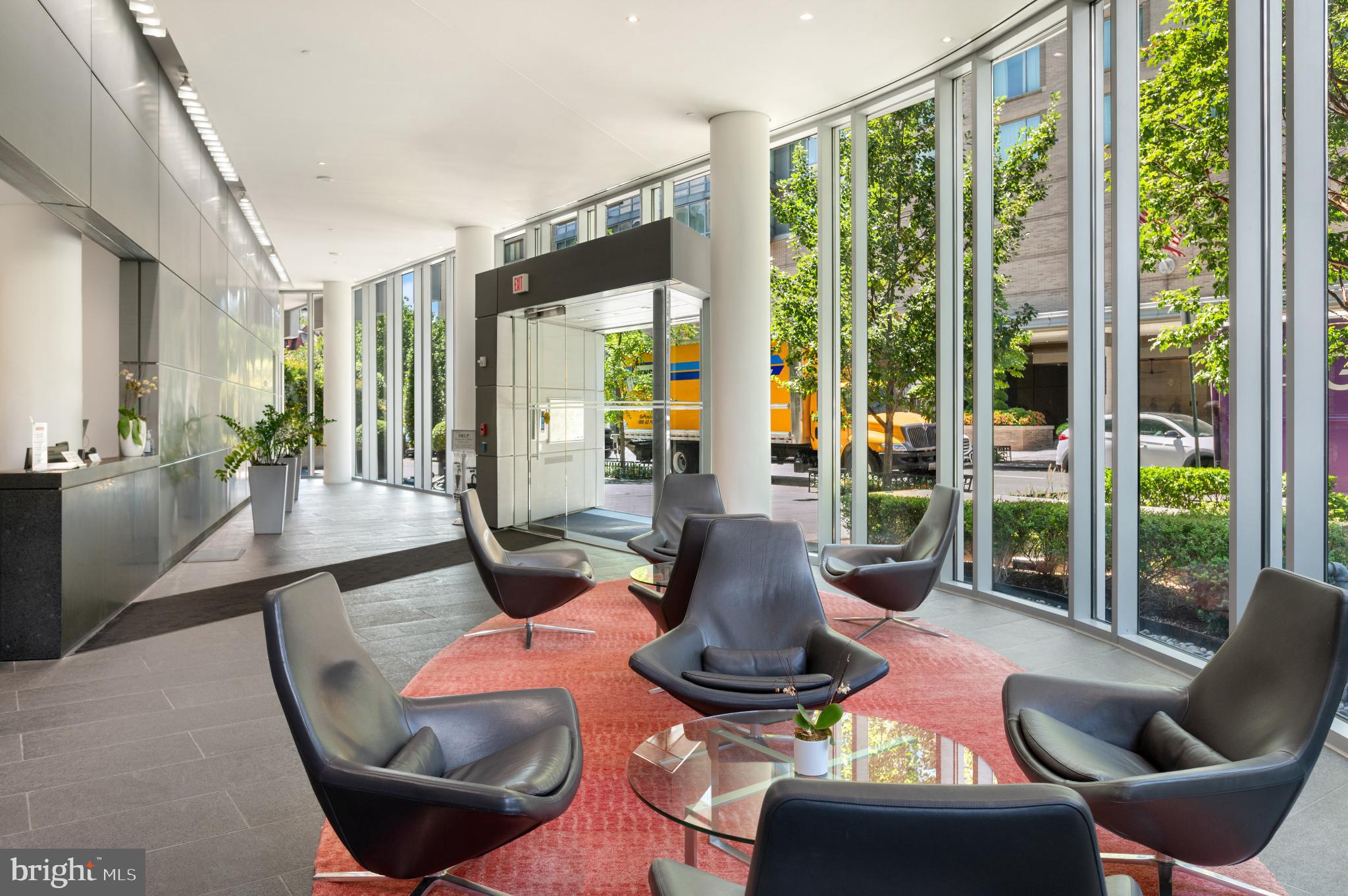 1177 22nd Street Northwest, Unit 2K Washington, DC 20037 - Photo 18 of 21 a living room with furniture and a large window