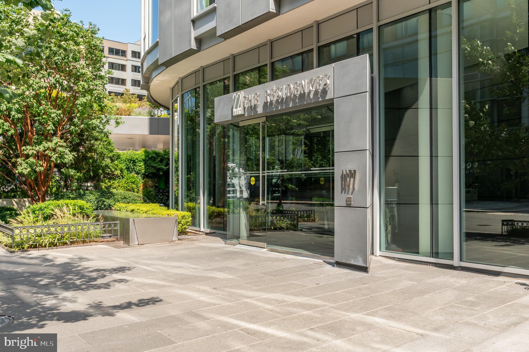 1177 22nd Street Northwest, Unit 2K Washington, DC 20037 - Photo 20 of 21 a front view of a building with garden