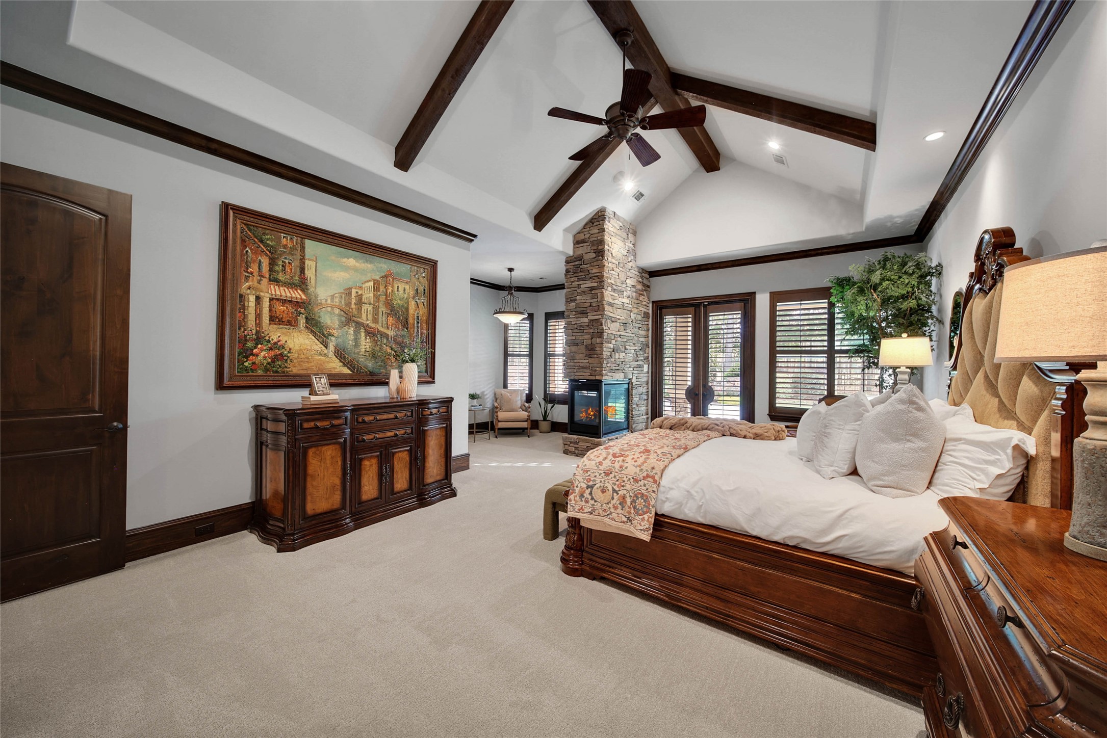 852 Eagle Pointe Montgomery, TX 77316 - Photo 5 of 48 a bedroom with a large bed and a flat tv screen on dresser