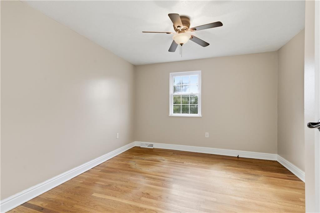 174 North Jamestown Road Coraopolis, PA 15108 - Photo 17 of 27 an empty room with wooden floor and windows