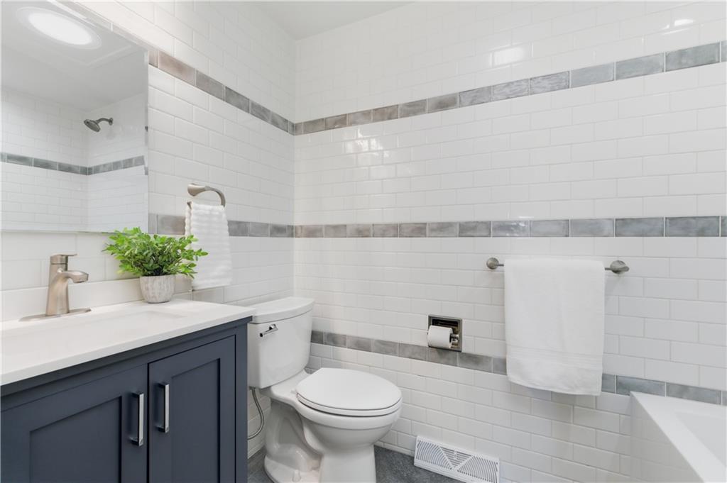 174 North Jamestown Road Coraopolis, PA 15108 - Photo 18 of 27 a bathroom with a sink a toilet and mirror
