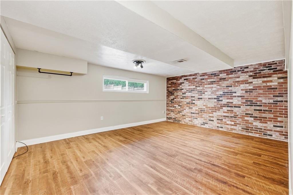 174 North Jamestown Road Coraopolis, PA 15108 - Photo 19 of 27 a view of an empty room with wooden floor and a window