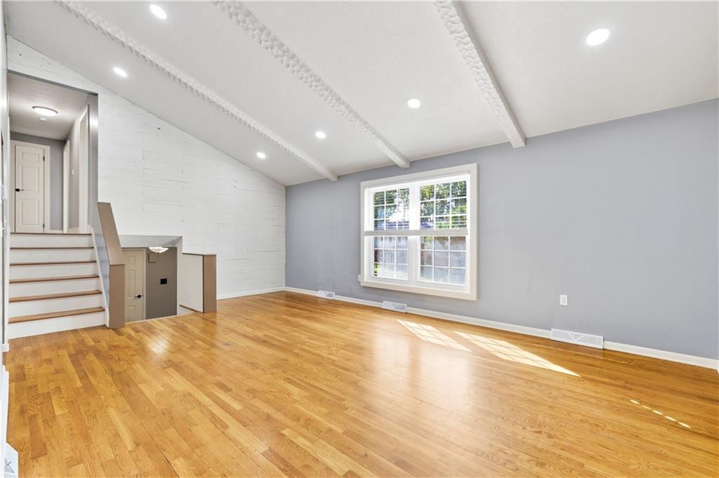 174 North Jamestown Road Coraopolis, PA 15108 - Photo 5 of 27 a view of an empty room with wooden floor and a window
