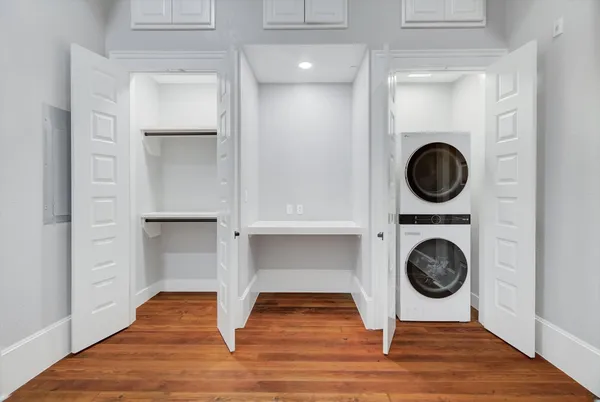a view of walk in closet with empty racks