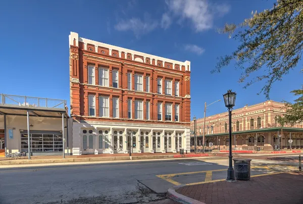 a front view of a building with street view