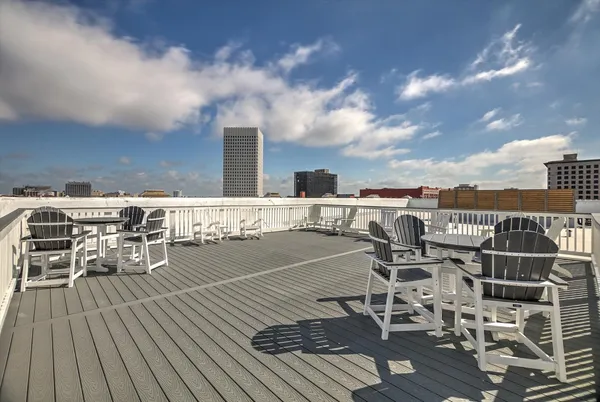 a view of a terrace with wooden floor and city view