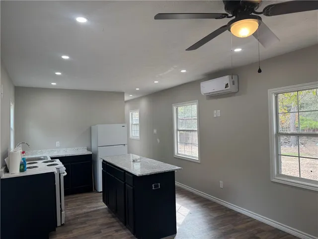 a kitchen with lots of counter space and a sink