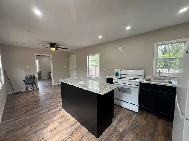 a kitchen with a sink and cabinets
