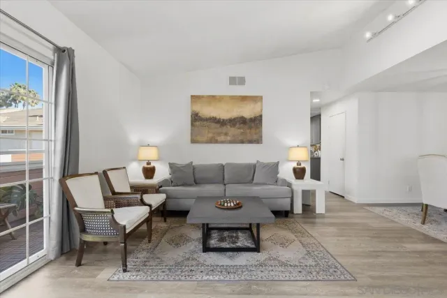 a kitchen with a sink cabinets and stainless steel appliances