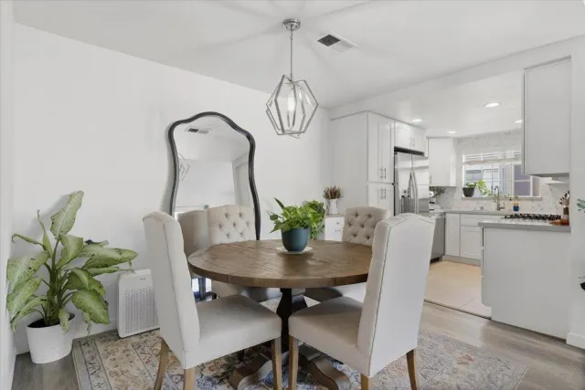 a kitchen with a sink and a refrigerator