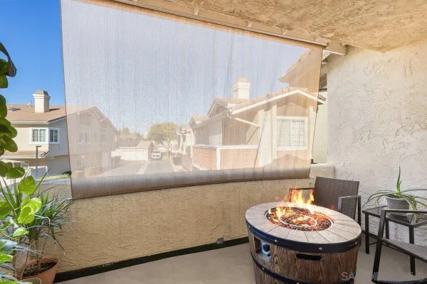 a view of washer and dryer with kitchen in the background