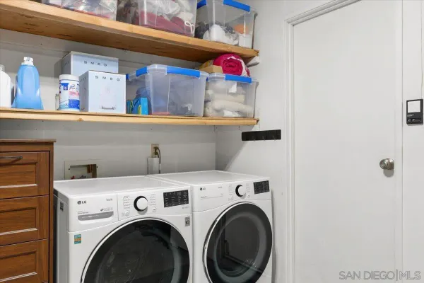 a view of a house with swimming pool and sitting area