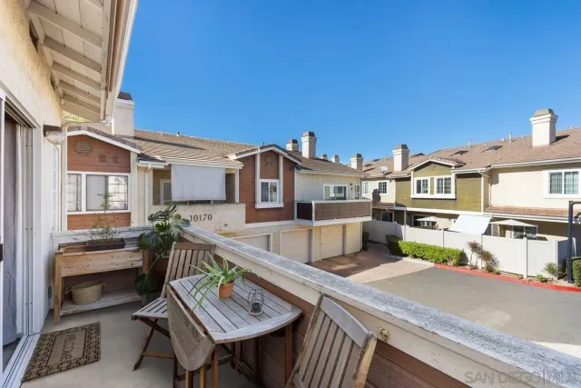a view of a terrace with furniture and a potted plant