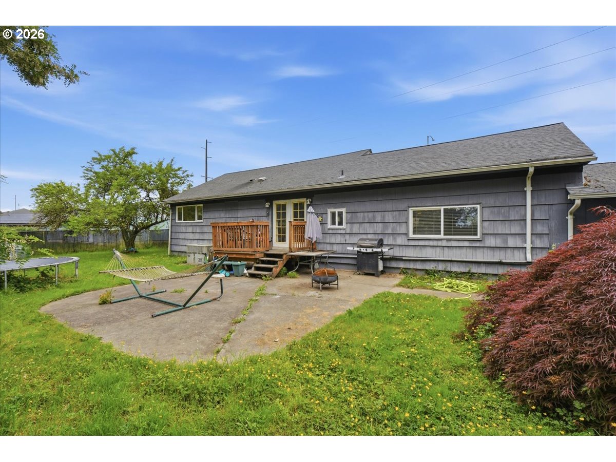 3287 Olive Way Longview, WA 98632 - Photo 19 of 24 a swimming pool with outdoor seating and yard