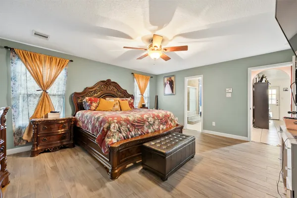 a bedroom with a bed and window