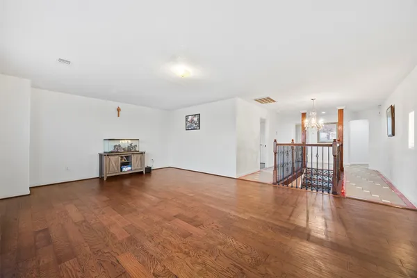 a view of a livingroom with furniture and an empty room