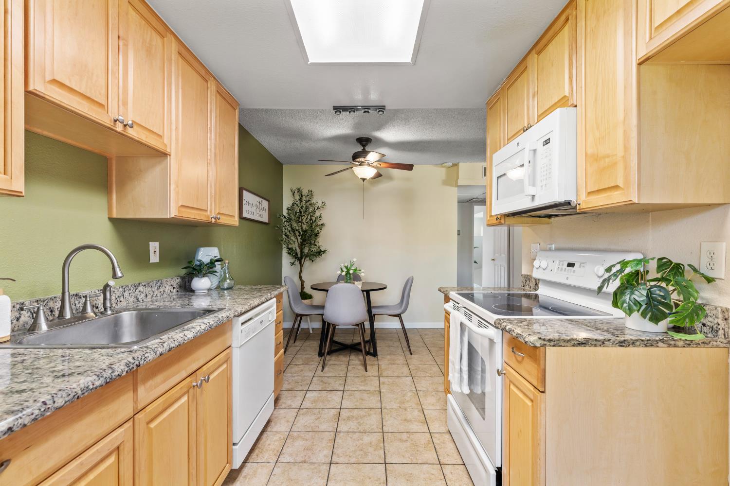 1313 Floyd Avenue, Unit 179 Modesto, CA 95355 - Photo 13 of 28 a kitchen with stainless steel appliances granite countertop a sink a stove and cabinets