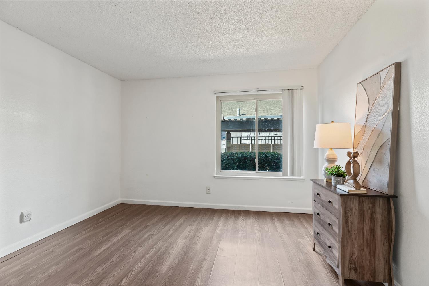 1313 Floyd Avenue, Unit 179 Modesto, CA 95355 - Photo 16 of 28 an empty room with a window