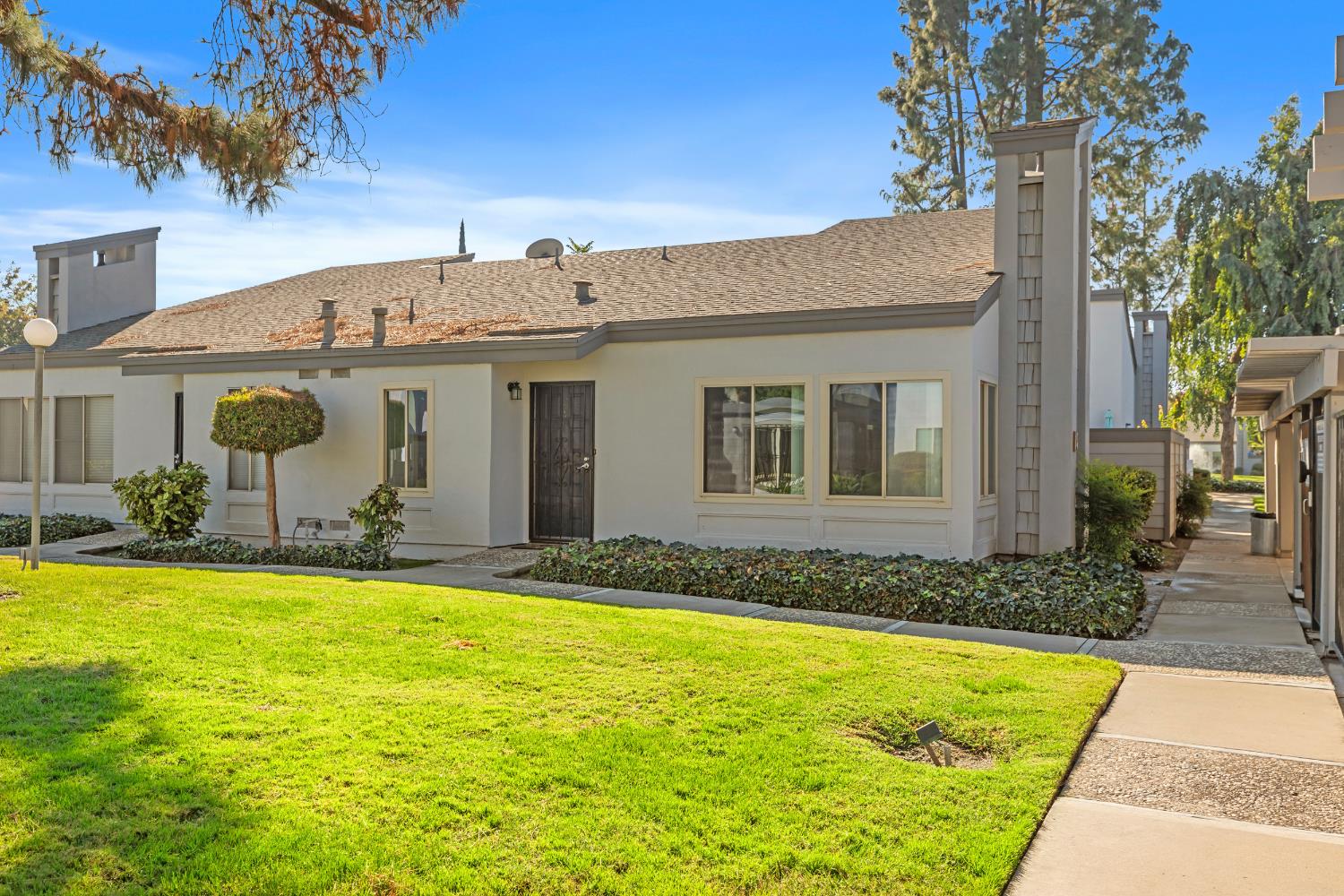 1313 Floyd Avenue, Unit 179 Modesto, CA 95355 - Photo 3 of 28 a view of a house with swimming pool
