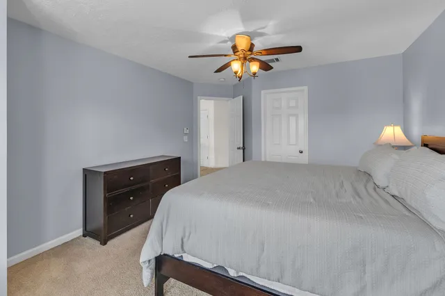 a bathroom with a sink a toilet and bathtub