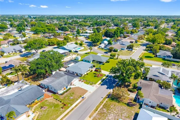 an aerial view of residential house and swimming pool