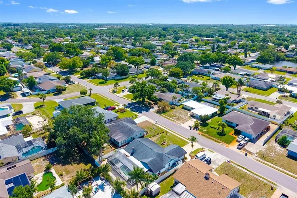 an aerial view of a house with a yard