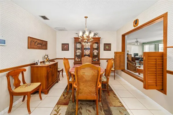 a kitchen with stainless steel appliances granite countertop a refrigerator a stove and a sink