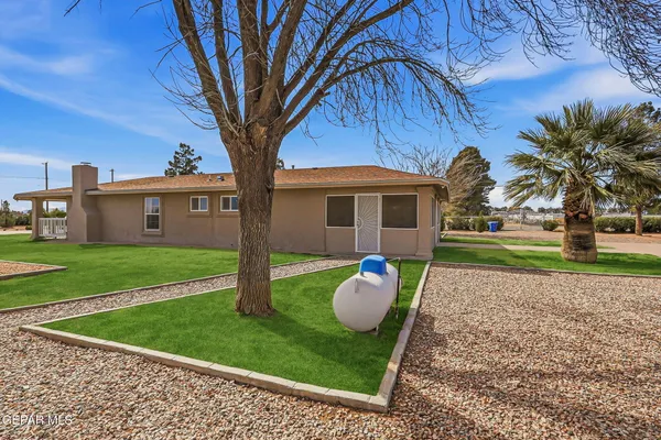 a view of a livingroom with a ceiling fan and window