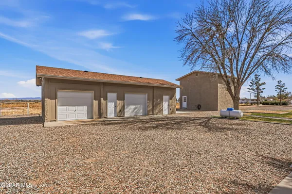 a view of a backyard of a house