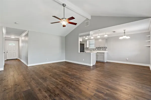 a view of a kitchen with a dishwasher cabinets and wooden floor