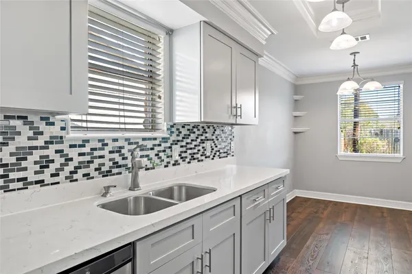 a kitchen with a sink and a window