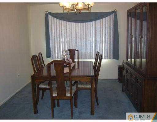 33 Meredith Road Piscataway, NJ 08854 - Photo 2 of 8 a view of a dining room with furniture and window