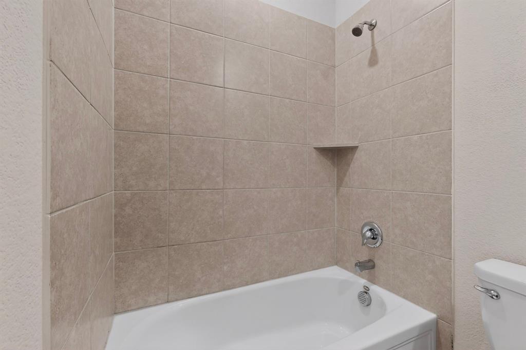 3321 Riverside Drive Aubrey, TX 76227 - Photo 18 of 40 a bathroom with a bathtub