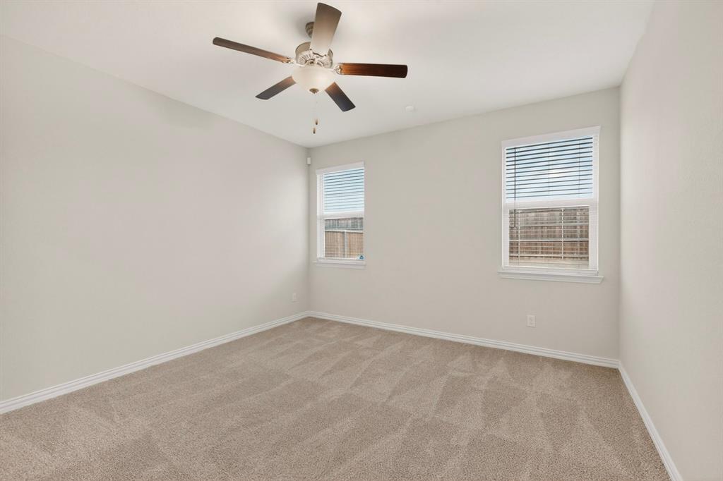 3321 Riverside Drive Aubrey, TX 76227 - Photo 19 of 40 an empty room with a window and a fan