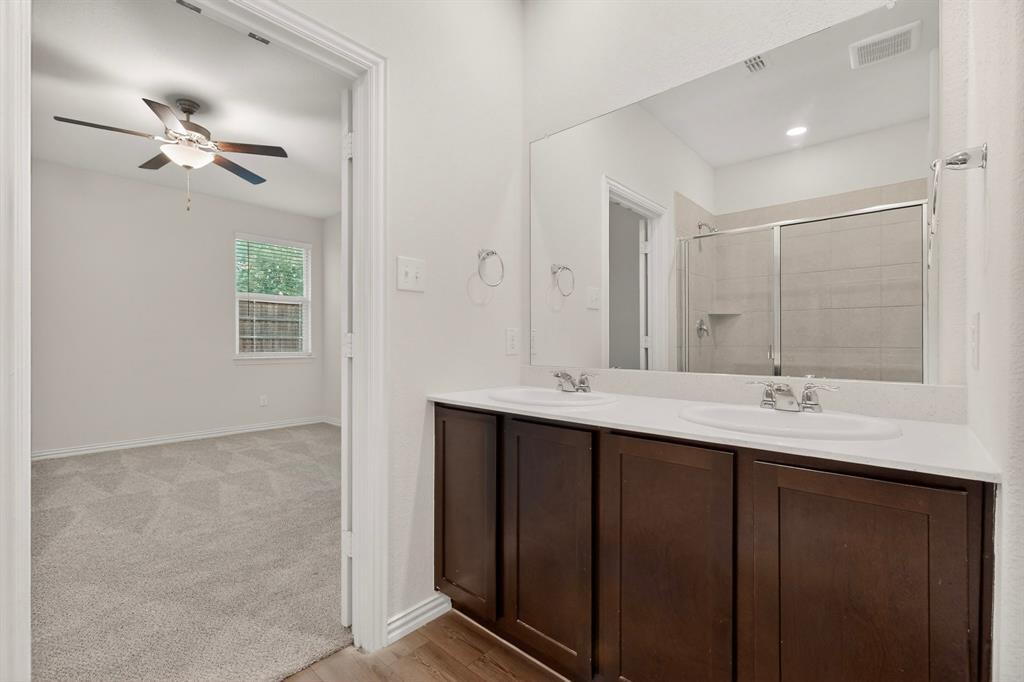 3321 Riverside Drive Aubrey, TX 76227 - Photo 23 of 40 a bathroom with double sink and a mirror