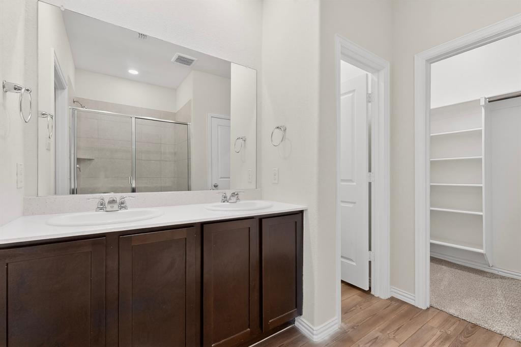 3321 Riverside Drive Aubrey, TX 76227 - Photo 24 of 40 a bathroom with double sink and mirror