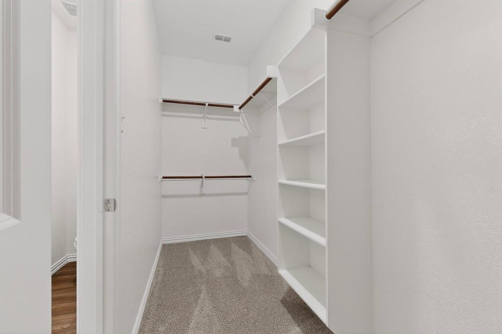 3321 Riverside Drive Aubrey, TX 76227 - Photo 32 of 40 a view of walk in closet with empty racks