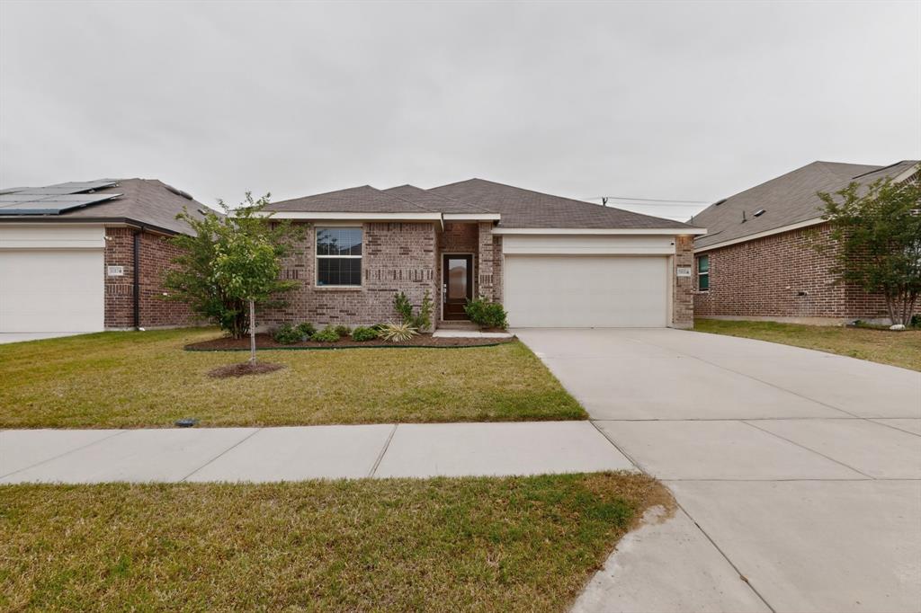 3321 Riverside Drive Aubrey, TX 76227 - Photo 4 of 40 a front view of a house with a yard and garage