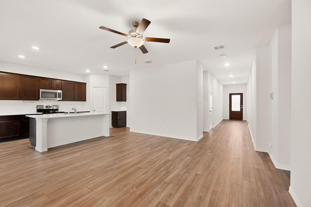 3321 Riverside Drive Aubrey, TX 76227 - Photo 6 of 40 a view of kitchen with cabinets and wooden floor