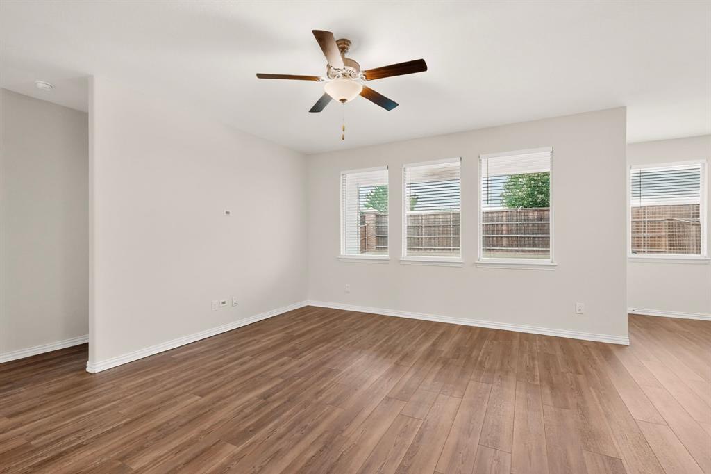 3321 Riverside Drive Aubrey, TX 76227 - Photo 7 of 40 wooden floor in an empty room with a window