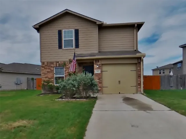 a house view with a garden space