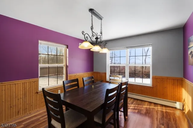 a dining room with furniture and window
