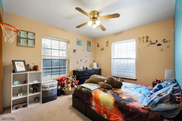 a bedroom with bed and a window