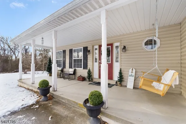 a building outdoor space with patio furniture and potted plants