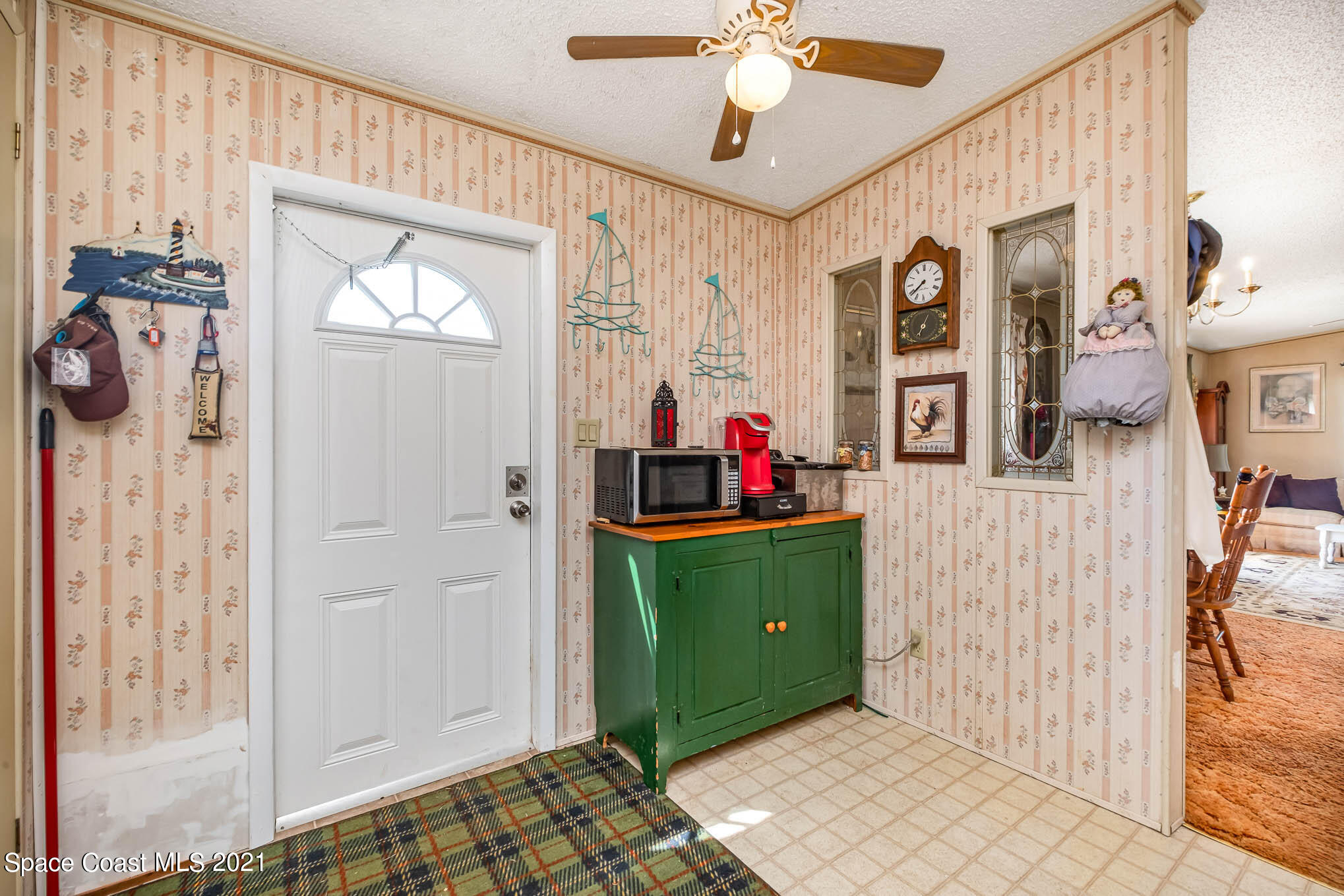 1965 Hammock Road Titusville, FL 32796 - Photo 6 of 17 Front door/Kitchen