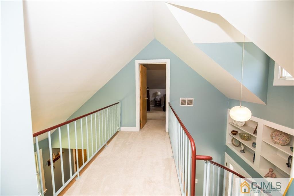 91 Conover Road West Windsor, NJ 08550 - Photo 13 of 25 a view of staircase with railing and a rug