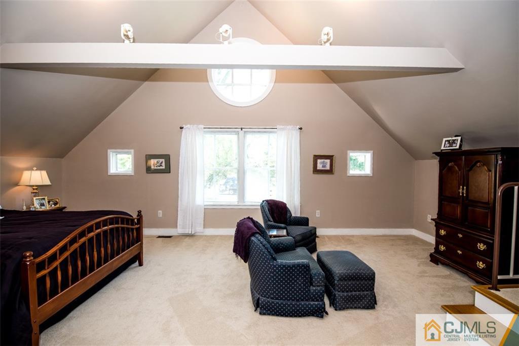 91 Conover Road West Windsor, NJ 08550 - Photo 14 of 25 a bedroom with furniture and a window