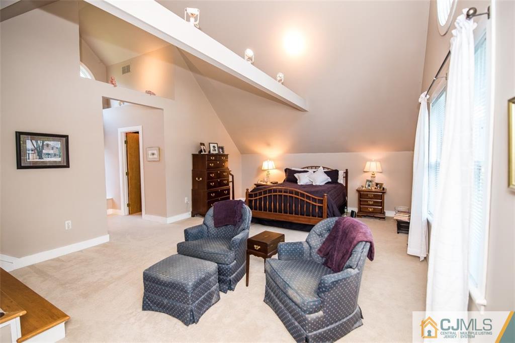 91 Conover Road West Windsor, NJ 08550 - Photo 16 of 25 a living room with furniture and a flat screen tv